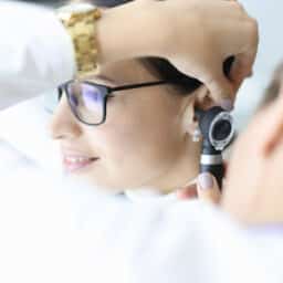 ENT specialist conducting an ear exam